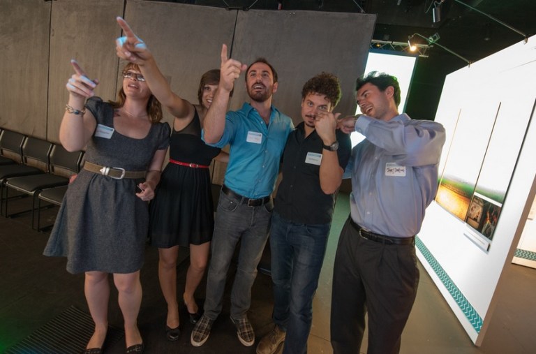 CURIIs Kat Huggins and Anjali Phukan with CISA3 researchers DV, Vid Petrovic, and former CURII turned Calit2 researcher James M. Darling at the opening of the Exodus Event.