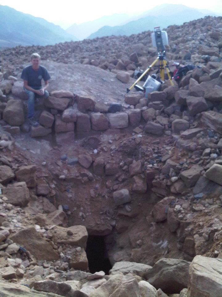 Field Assistant Ross Davison and the Leica Scanstation 2 working on the Looter's Pit of Khirbat Faynan in the foreground. 
