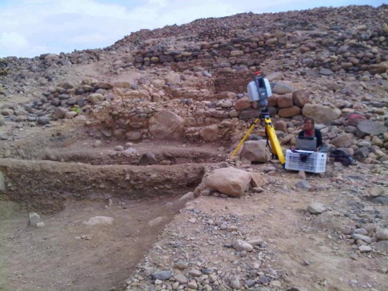 Field Assistant Leah Trujillo setting up the Leica Scanstation 2 to digitize the shallow excavation area at the base of Khirbat Faynan's western slopes. 
