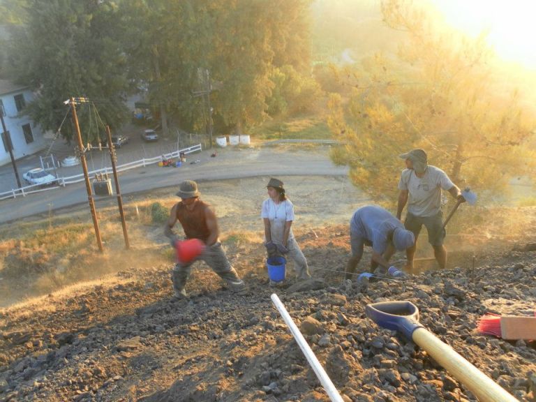 The team undertaking light excavation of a mine face at Skouriotissa. 