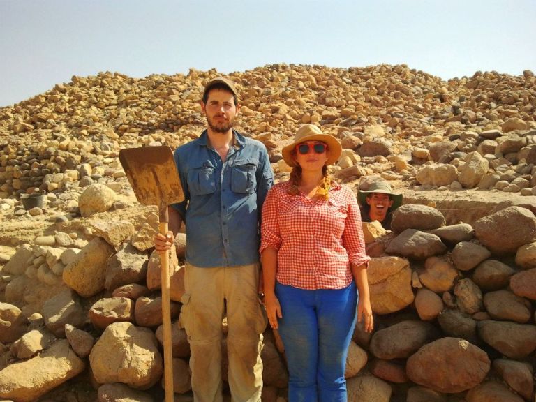 Archaeologists Aaron Gidding and Ashley M. Richter as  Jordanian Gothic in front of Aaron's excavation at Khirbat Faynan. 