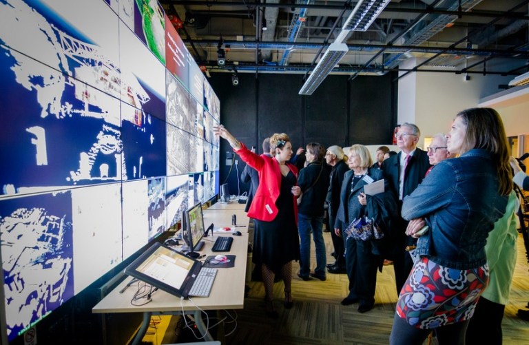 Ashley M. Richter demonstrating the latest digital archaeology laser scanning results from Petra to Irwin and Joan Jacobs of Qualcomm and CISA3 Project Manager Alexandra Hubenko. 