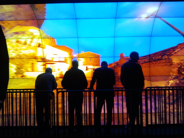 Visitors at the WAVE check out stereoscopic images of Rocca Imperiale. 