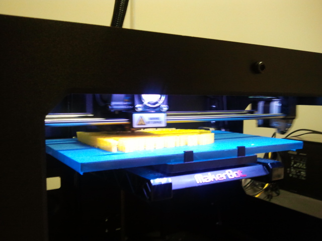 A Calit2 3D Printer at work on the base of our mini-Artemsion Bronze. We opted to print him first since the University of California, San Diego utilizes it as the inspiration for one of their logos. 